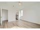 Spacious main bedroom with a ceiling fan and view into an ensuite bathroom at 669 Elliot Peak Ave, Las Vegas, NV 89183