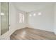 An airy room filled with light through a trio of windows above a large statement window at 669 Elliot Peak Ave, Las Vegas, NV 89183