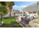 Landscaped backyard with a covered grill area and pool, perfect for outdoor living at 6695 Shadow Cove Ave, Las Vegas, NV 89139