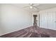 Empty bedroom with ceiling fan, double closet, and neutral walls at 6695 Shadow Cove Ave, Las Vegas, NV 89139