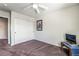 Bedroom featuring carpeted floor, closet with sliding doors, and ceiling fan at 6695 Shadow Cove Ave, Las Vegas, NV 89139
