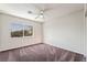 Bright bedroom featuring a ceiling fan and a window with a view at 6695 Shadow Cove Ave, Las Vegas, NV 89139