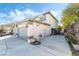 Home's exterior view featuring a two-car garage and well-maintained landscaping at 6695 Shadow Cove Ave, Las Vegas, NV 89139