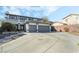 Beautiful two-story home with a three-car garage, driveway, and well-maintained landscaping at 6695 Shadow Cove Ave, Las Vegas, NV 89139