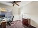 Bedroom or office features large window and classic desk at 6695 Shadow Cove Ave, Las Vegas, NV 89139