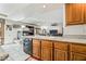Open-concept kitchen with granite countertops, stylish cabinetry, and modern appliances at 6695 Shadow Cove Ave, Las Vegas, NV 89139