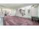 Expansive living space featuring elegant columns, staircase, and decorative knight at 6695 Shadow Cove Ave, Las Vegas, NV 89139