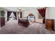Large main bedroom showcasing a king-size bed and dark wood furnishings at 6695 Shadow Cove Ave, Las Vegas, NV 89139