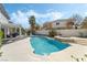 Backyard oasis featuring a sparkling in-ground pool, hot tub, and outdoor lounge area, perfect for entertaining at 6695 Shadow Cove Ave, Las Vegas, NV 89139