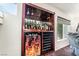 The in-home wet bar includes a beverage fridge and wine rack at 6695 Shadow Cove Ave, Las Vegas, NV 89139