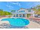Expansive backyard featuring a sparkling pool and covered patio, ideal for outdoor enjoyment and relaxation at 6965 S Valley View Blvd, Las Vegas, NV 89118