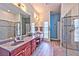 Spacious bathroom featuring dual sinks and a modern glass-enclosed shower at 6965 S Valley View Blvd, Las Vegas, NV 89118