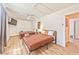 Cozy bedroom with two beds, ceiling fan, and warm inviting decor at 6965 S Valley View Blvd, Las Vegas, NV 89118
