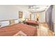 Well-lit bedroom features two beds, wood-look flooring, and ample natural light at 6965 S Valley View Blvd, Las Vegas, NV 89118