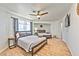 Bright bedroom with two beds, a ceiling fan, and natural light from the window at 6965 S Valley View Blvd, Las Vegas, NV 89118