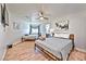 Well-lit bedroom with two beds, modern decor, and wood-look flooring at 6965 S Valley View Blvd, Las Vegas, NV 89118