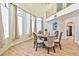 Charming dining room features a wooden table with ornate chairs and light-filled arched windows at 6965 S Valley View Blvd, Las Vegas, NV 89118