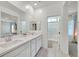 En-suite bathroom with double sinks, a walk-in shower, and bright lighting at 7304 N Decatur Blvd # 6, North Las Vegas, NV 89131