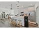 Modern kitchen with stainless steel appliances, white cabinets, and a spacious island with barstool seating at 7304 N Decatur Blvd # 6, North Las Vegas, NV 89131
