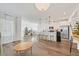 Open-concept kitchen with stainless steel appliances, white cabinetry, and a breakfast bar with seating at 7304 N Decatur Blvd # 6, North Las Vegas, NV 89131