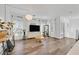 Bright living room with hardwood floors, modern lighting, and large windows providing natural light at 7304 N Decatur Blvd # 6, North Las Vegas, NV 89131