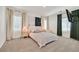 Bright main bedroom with neutral decor, plush carpet, and an en-suite bathroom at 7304 N Decatur Blvd # 6, North Las Vegas, NV 89131