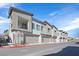 Charming townhome featuring a private balcony and attached one-car garage along a city street at 7304 N Decatur Blvd # 6, North Las Vegas, NV 89131