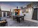 Outdoor area features a dining area, a lounge with an umbrella, exterior lighting, and access to a rooftop deck at 813 Bonita Ave, Las Vegas, NV 89104