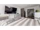 Spacious bedroom with a large television, closet with sliding doors, and neutral tones at 813 Bonita Ave, Las Vegas, NV 89104