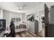 Well-lit bedroom with a ceiling fan, large window, and contemporary furnishings at 813 Bonita Ave, Las Vegas, NV 89104