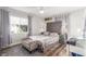 Serene bedroom with a tufted headboard, soft lighting, and neutral decor at 813 Bonita Ave, Las Vegas, NV 89104