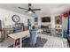 Charming dining area features unique patterned flooring, a ceiling fan, and ample natural light at 813 Bonita Ave, Las Vegas, NV 89104