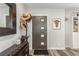 Stylish foyer featuring a modern door, elegant decor, and wood-look flooring at 813 Bonita Ave, Las Vegas, NV 89104