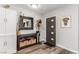 Welcoming foyer showcases stylish decor, modern door and wood-look flooring at 813 Bonita Ave, Las Vegas, NV 89104