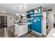 Bright kitchen with white cabinets, stainless appliances, and a view into the dining area at 813 Bonita Ave, Las Vegas, NV 89104