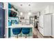 Bright kitchen featuring modern white cabinetry, quartz countertops, and an island with seating at 813 Bonita Ave, Las Vegas, NV 89104