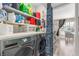 Well-organized laundry room with shelving and modern front-loading washer and dryer, convenient and efficient at 813 Bonita Ave, Las Vegas, NV 89104