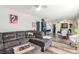 Inviting living room featuring a comfortable gray sectional sofa and hardwood flooring at 813 Bonita Ave, Las Vegas, NV 89104