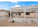 The spacious backyard features a covered patio, a pergola, and desert landscaping at 845 Holly Lake Way, Henderson, NV 89002