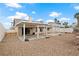 Spacious backyard with a covered patio and pergola, completed with low-maintenance desert landscaping at 845 Holly Lake Way, Henderson, NV 89002