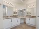 Luxurious bathroom with dual sinks, granite countertops, large mirror and vanity at 845 Holly Lake Way, Henderson, NV 89002