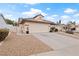 Charming single-story home with a well-maintained yard and a two-car garage on a sunny day at 845 Holly Lake Way, Henderson, NV 89002