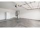 Spacious garage with a refrigerator and water softener system ready for your vehicles and storage needs at 845 Holly Lake Way, Henderson, NV 89002