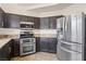 Bright kitchen featuring stainless steel appliances, a double oven, and ample cabinet space for storage at 845 Holly Lake Way, Henderson, NV 89002