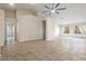 Spacious living room with tile floors, vaulted ceiling, and large windows with sheer curtains at 845 Holly Lake Way, Henderson, NV 89002