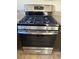 Stainless steel gas range with a self-cleaning oven features a sleek design and granite countertops at 845 Holly Lake Way, Henderson, NV 89002