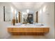 Elegant bathroom featuring a double sink vanity, a large mirror, and stylish pendant lights at , Henderson, NV 89011