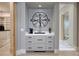 Wet bar area with drink fridge adjacent to a luxury walk-in closet and bathroom at , Henderson, NV 89011