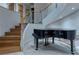 Elegant entryway with a spiral staircase, glass railings, and grand piano at , Henderson, NV 89011