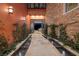 Grand entryway with water features and stone accents leading into a modern living space with plenty of natural light at , Henderson, NV 89011